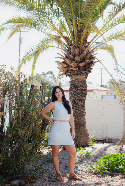 Top features a high, round neckline and sleeveless silhouette for ultimate comfort, style, and ease-of-wear